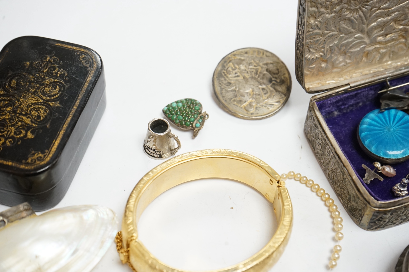 A group of assorted mainly costume and other jewellery including a silver bracelet hung with assorted coins and a Victorian enamelled mourning brooch, together with wrist watches, white metal box etc. Condition - poor to
